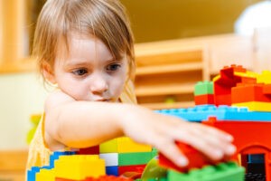 child playing with blocks