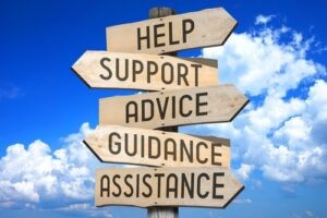 Signposts with the words support, advice and help on it