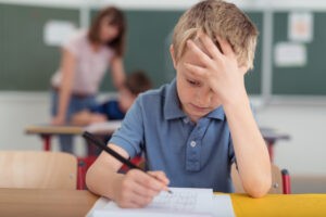 boy concentrating at school
