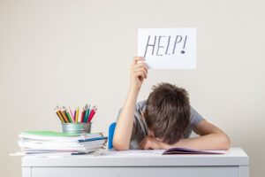 Boy saying Help needed
