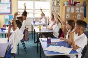 Pupils learning in a classroom