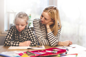 Mum and girl home learning