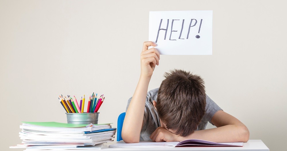 Child with a help sign