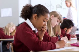 School girl in uniform in a lesson