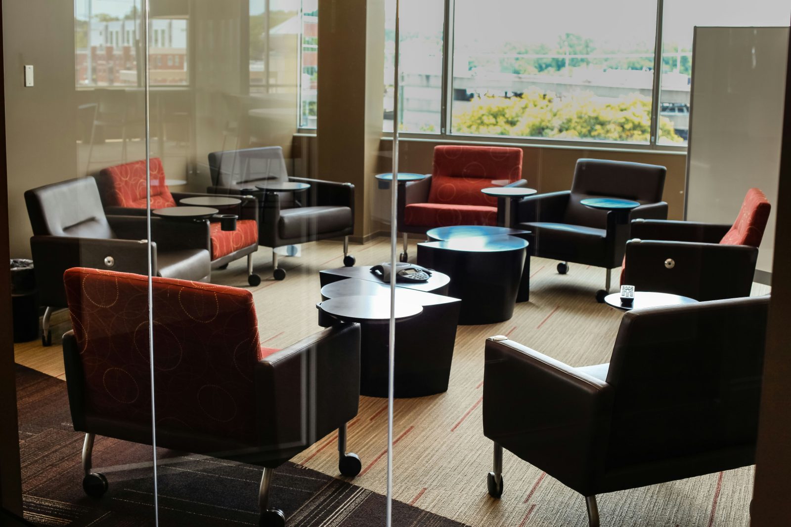 room with chairs and low tables