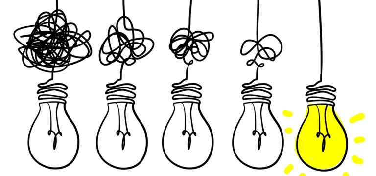 Five lightbulbs with progressively unravelling flex and the last lightbulb lit